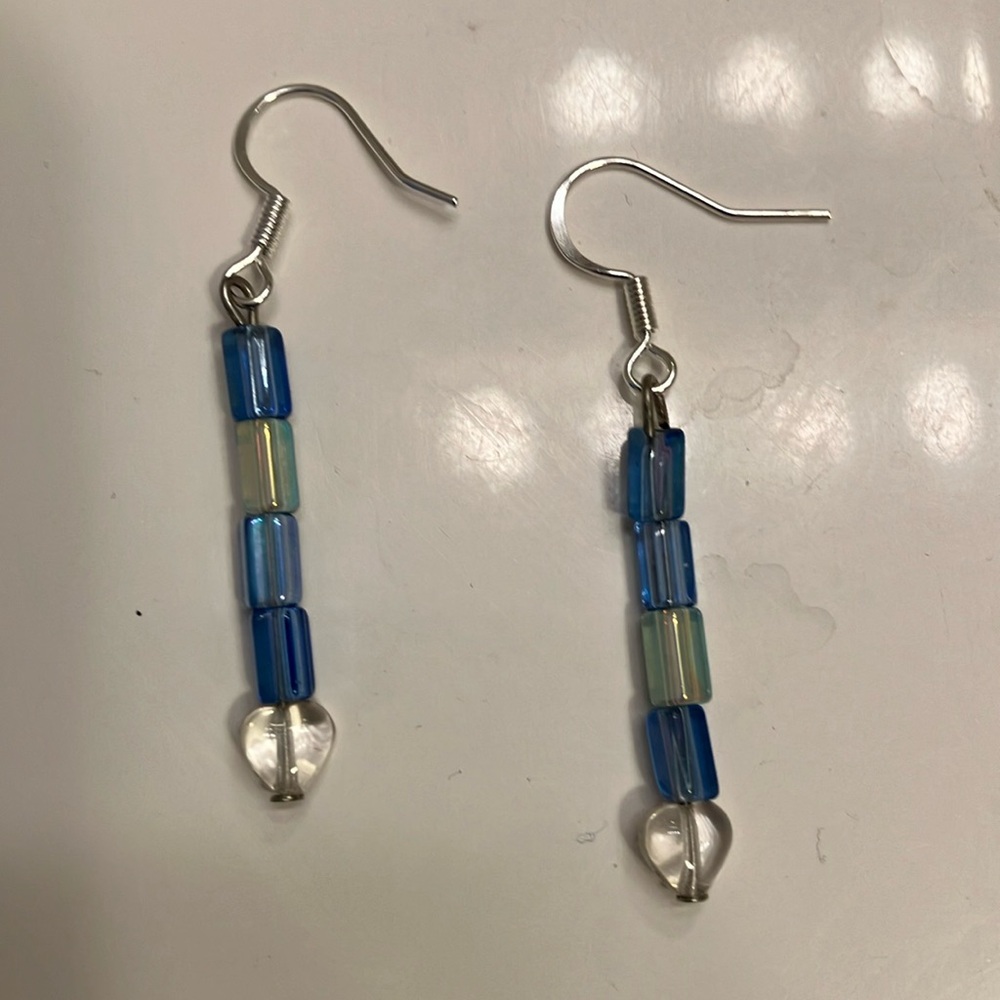 Blue iridescent crystal beads with clear glass hearts earrings. ￼